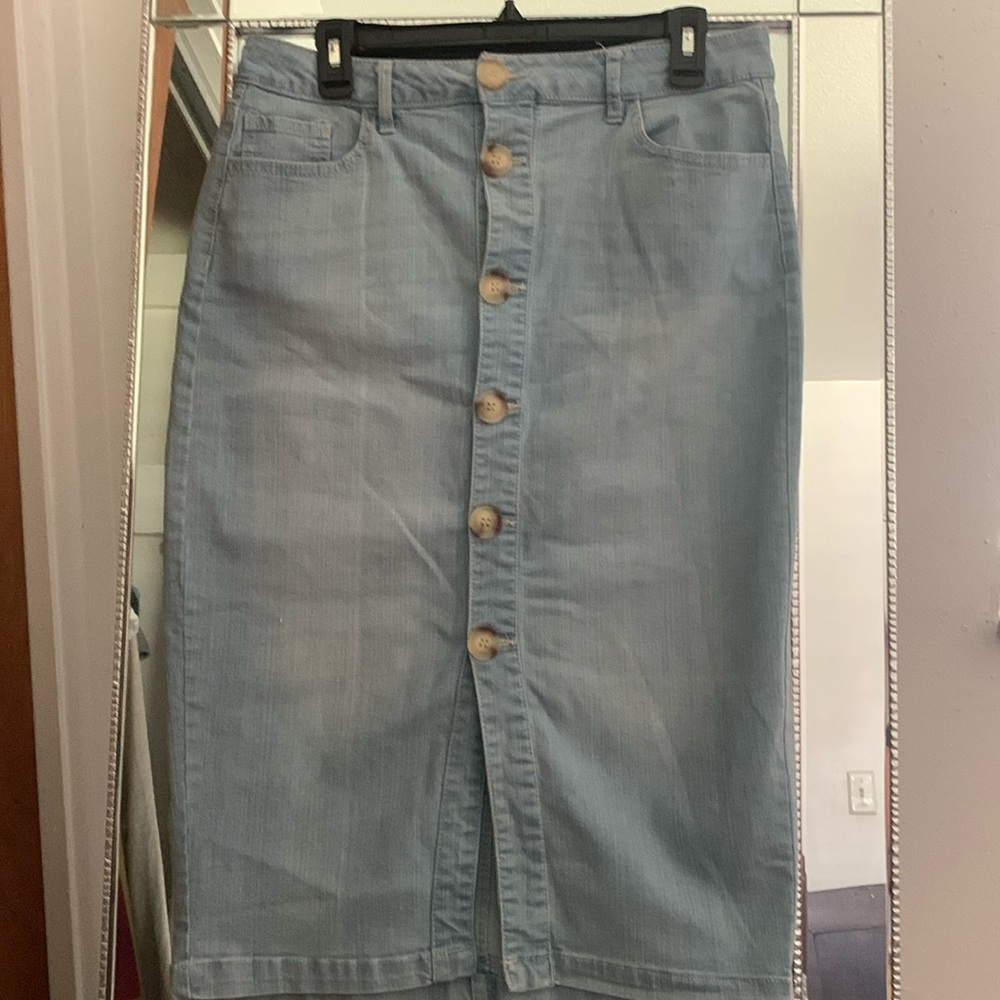 d. Jeans mid length skirt, light blue bottom in front.